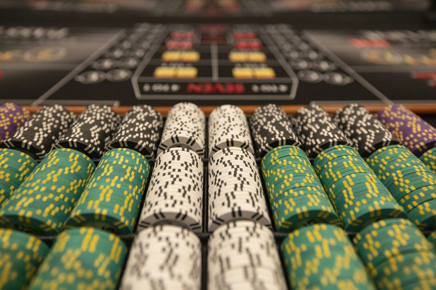 Stacks of casino poker chips at a high-stakes table